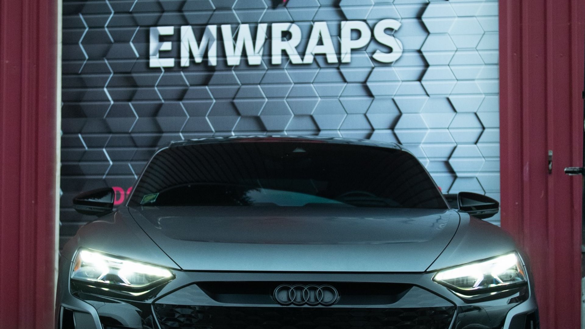 Dark gray Audi e-tron GT with full chrome delete in satin black at EMWRAPS