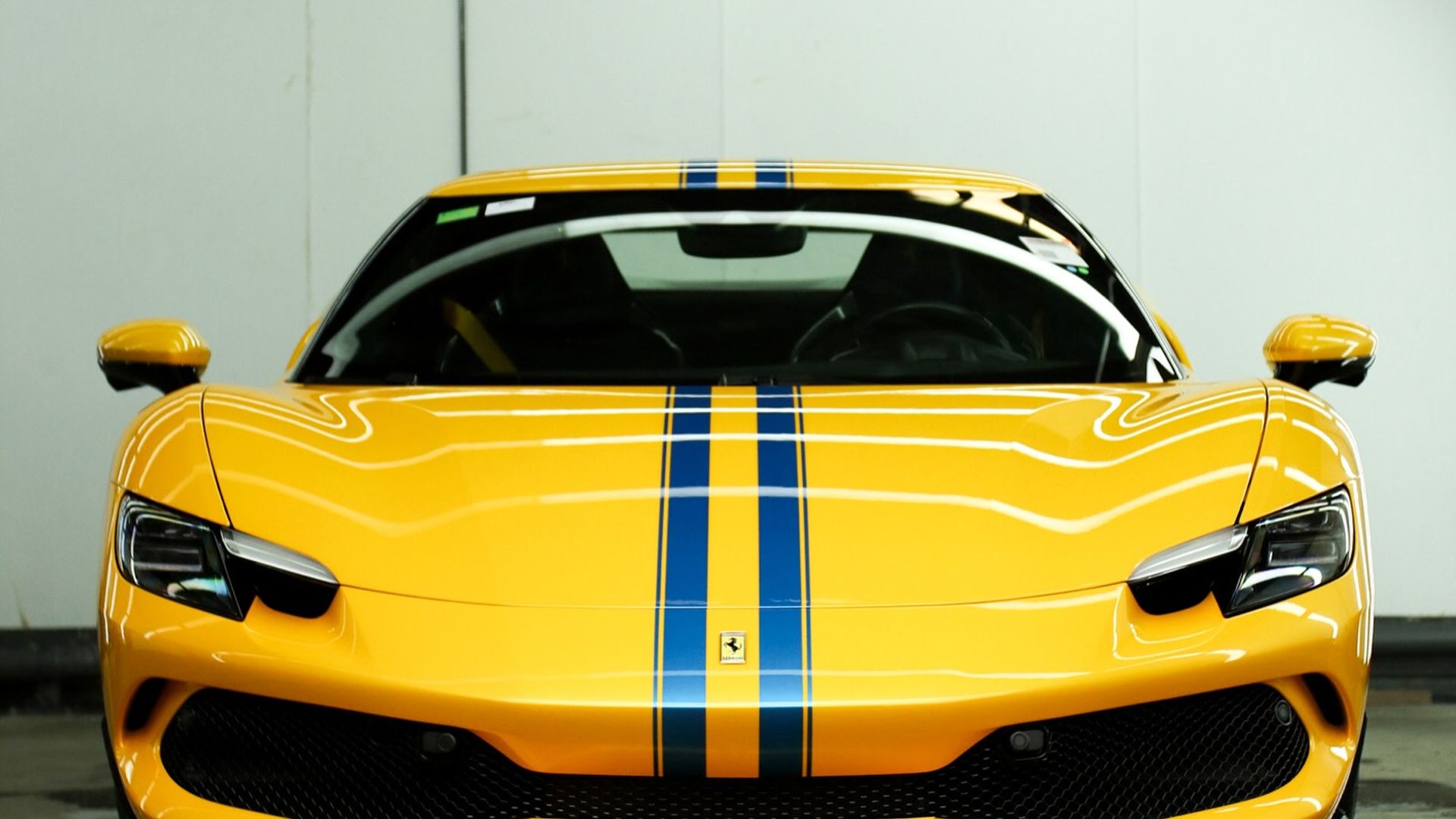 Yellow Ferrari 296 GTB with gloss PPF enhancing the Giallo Modena paint